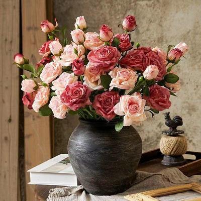 A Bouquet of Artificial Flowers with Three Tips and Scorched Edges, A Retro Home Living Room Decoration, and Dried Artificial Flowers