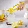 Spremiagrumi manuale per la casa in lega di alluminio pressato a mano spremiagrumi arancione pratico utensili da cucina portatili mini frullatore