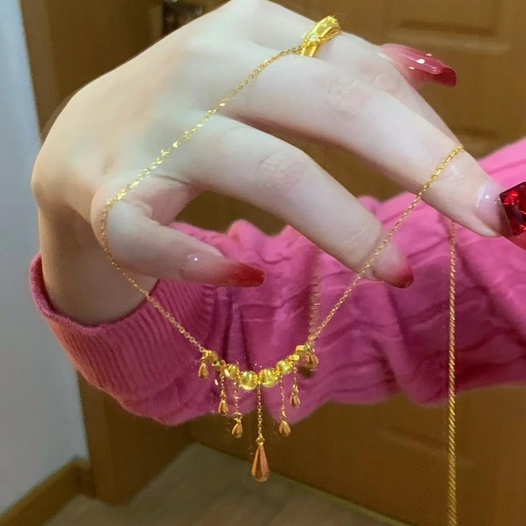 Light Luxury Fashion Water Drop Cat Eye Fringed Necklace Women'S Simple And Versatile Gold Flash Dancing Di Bead Spirit Dynamic Necklace
