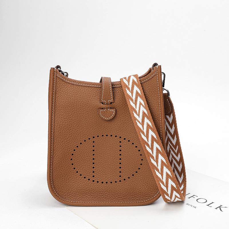 Factory wholesale first layer togo cowhide bucket bag women's bag lychee pattern hollow single shoulder crossbody bag hollow design