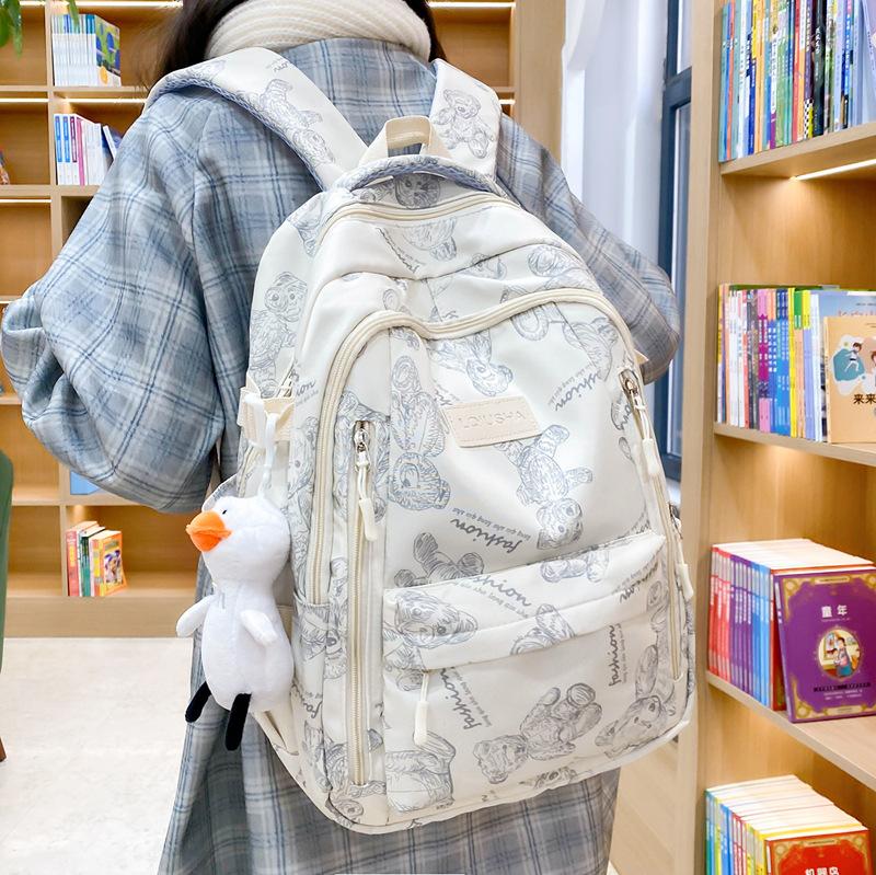 School bag for female junior high school students, simple and versatile printed bear niche design, college student computer backpack tide