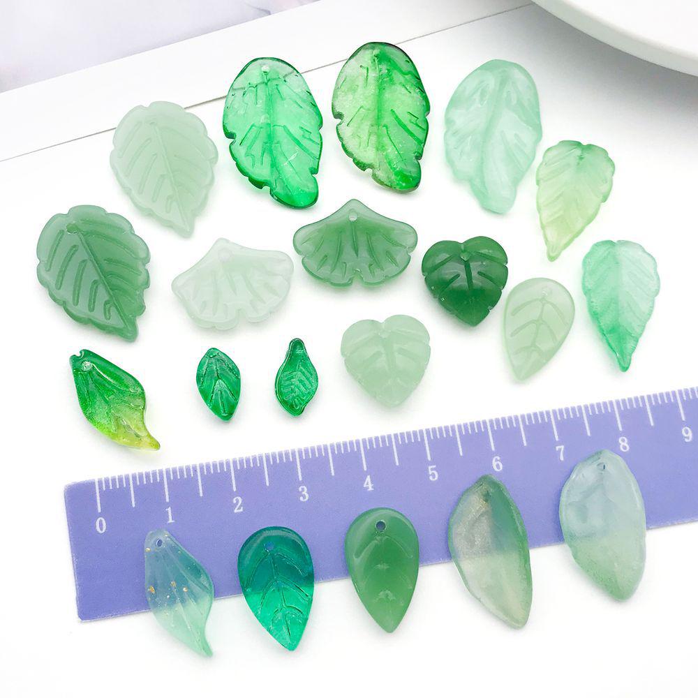 Set of 20 Green Transparent Faux Glass Leaf Pendants for DIY Bracelets, Necklaces, and Video Accessories.