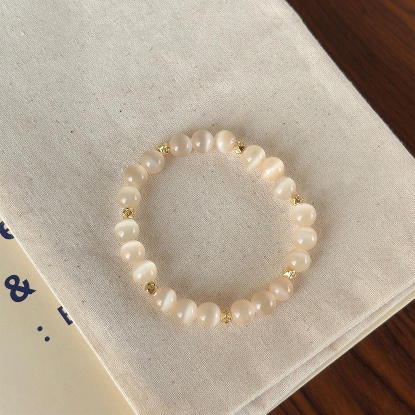 Elegant Champagne Cat s Eye Bracelet for Women - Niche Design, Luxurious Beaded Summer Hand Chain