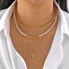Stacked pearl necklace collection European and American retro baroque special-shaped pearl OT buckle blade snake chain tassel