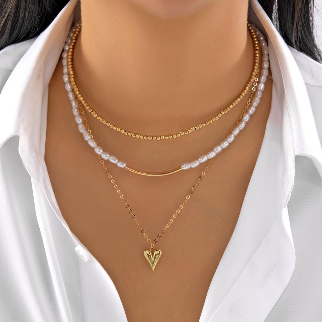 Stacked pearl necklace collection European and American retro baroque special-shaped pearl OT buckle blade snake chain tassel