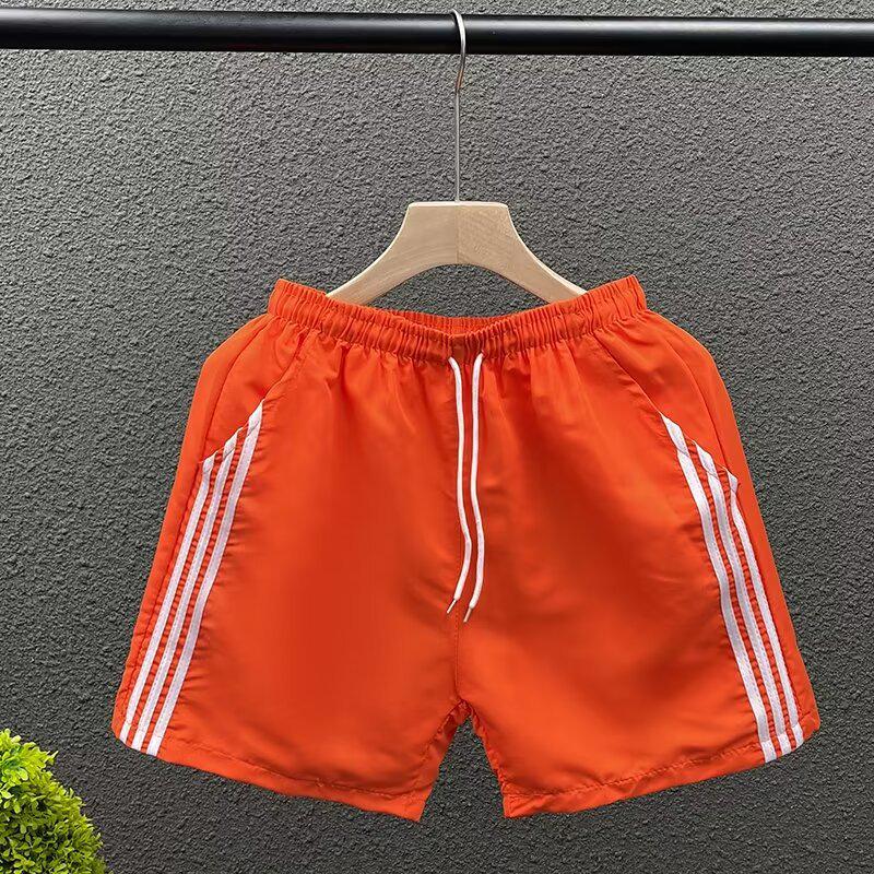 

Мужские быстросохнущие полосатые спортивные брюки длиной три четверти M оранжевый