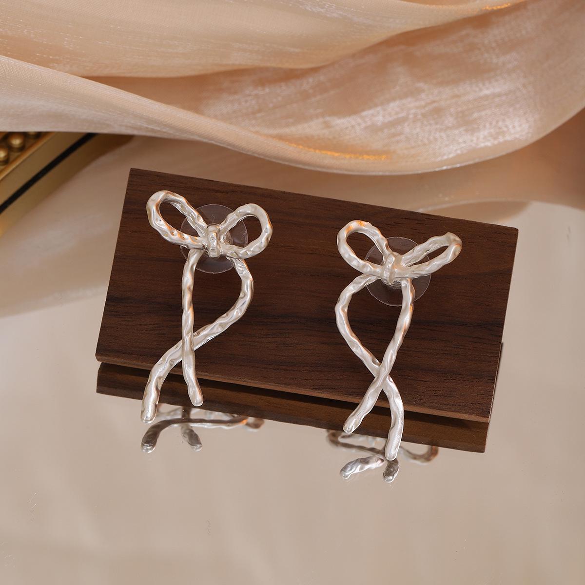 Silver Needle Korean Bow Earrings: Chic Metal Ribbon Studs for Women