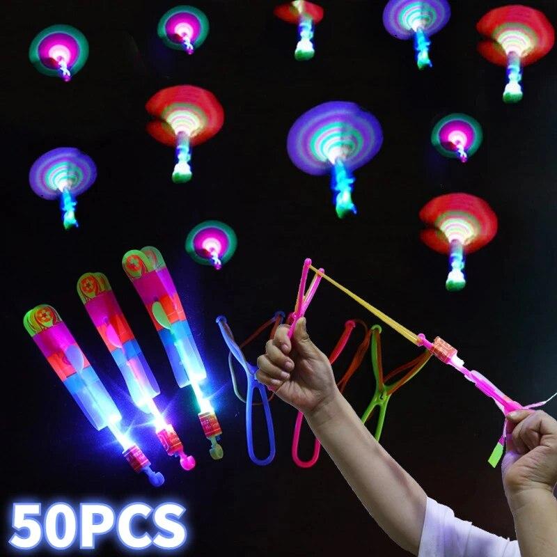 New 50/30/10/5/1Pcs Amazing Light Toy Arrow Rocket Helicopter Flying Toy LED Light Toys Party Fun Gifts Rubber Band Catapult