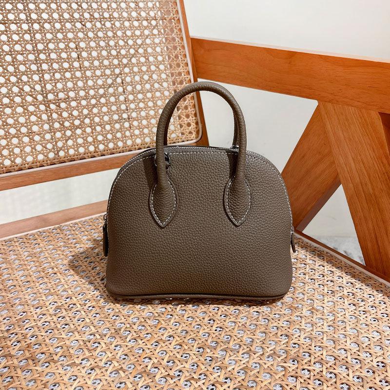First Layer Cowhide Handheld Women's Bag, High-end Niche Design, Shell Bag, Simple and Versatile Mini Messenger Bowling Bag