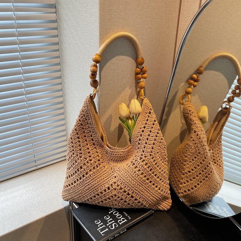 Seaside vacation beach bag women's new summer hollow bag commuting large capacity shoulder tote bag