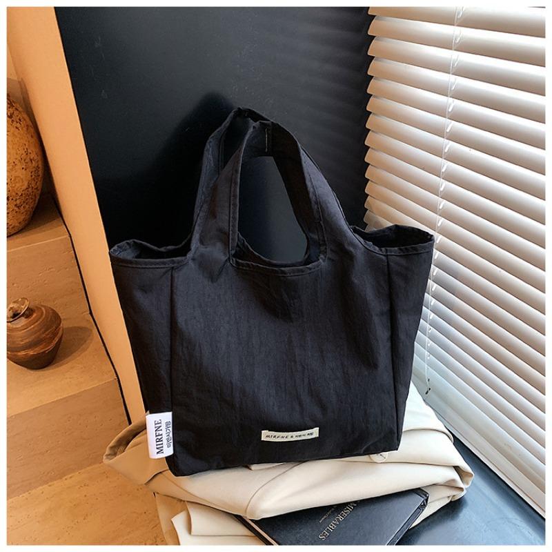 

New canvas bag, high-end color matching handbag for work, women s tote bag, portable and portable bag. чёрный