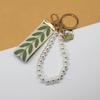 Trending 2025 Keychain Set Fashion Minimalist Pearl Car Keychain Woven Stripe Bag Charm Elegant Women Keychain Organizer Gift