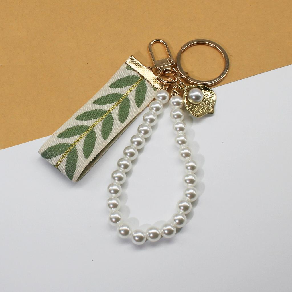 Trending 2025 Keychain Set Fashion Minimalist Pearl Car Keychain Woven Stripe Bag Charm Elegant Women Keychain Organizer Gift