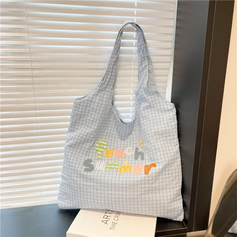 

Niche shoulder bag women s 2025 summer new cute embroidered shoulder bag fashionable and simple commuter tote bag синій