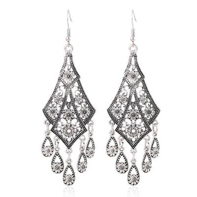Top-Selling Retro Ethnic Style Earrings: Hollow Carved Teardrop Tassels with Bold, Statement Design