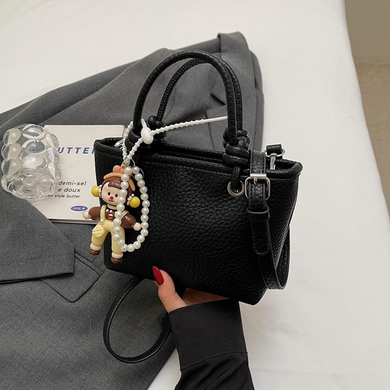 Fashion high-end hand bucket bag spring and summer simple and versatile shoulder bag trendy niche messenger bag