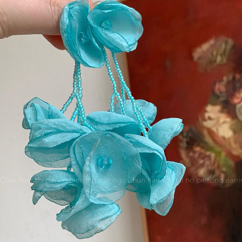 

Seaside vacation style mint green crystal flower fringed ear clips mosquito coil disc long exaggerated design stud earrings women