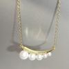 French Retro Crescent Pearl Necklace - Fashionable Irregular Clavicle Chain for Women in 2026