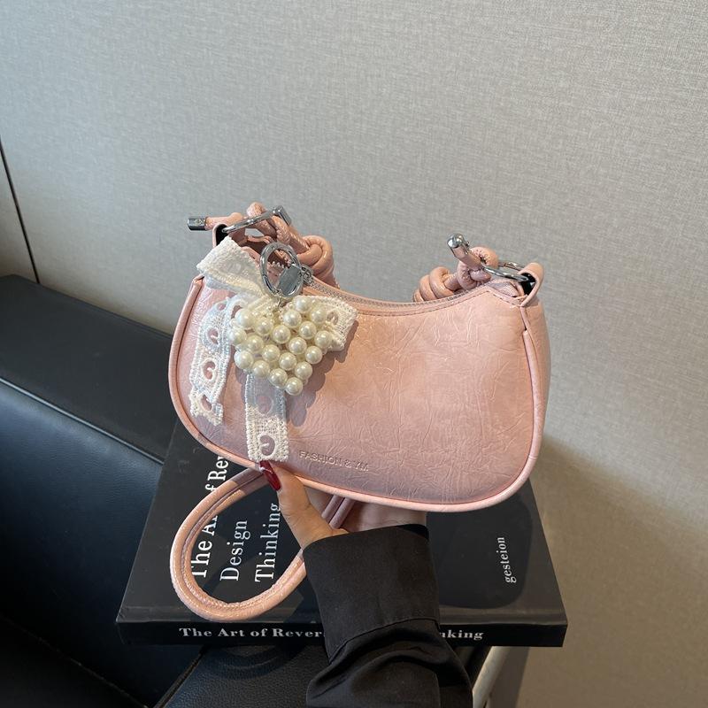 

Весна и лето популярная нишевая сумка женская 2025 новая универсальная сумка-мессенджер портативная сумка-пельмень розовый