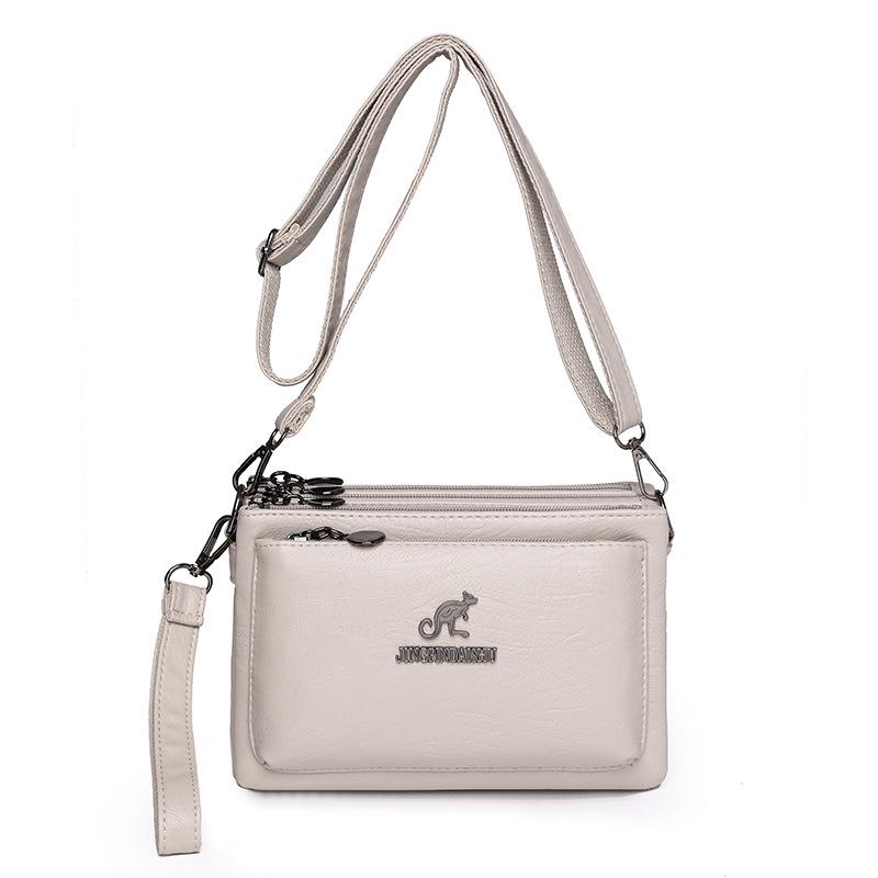 Trendig mjukt läder flerlagers damaxelväska/crossbodyväska