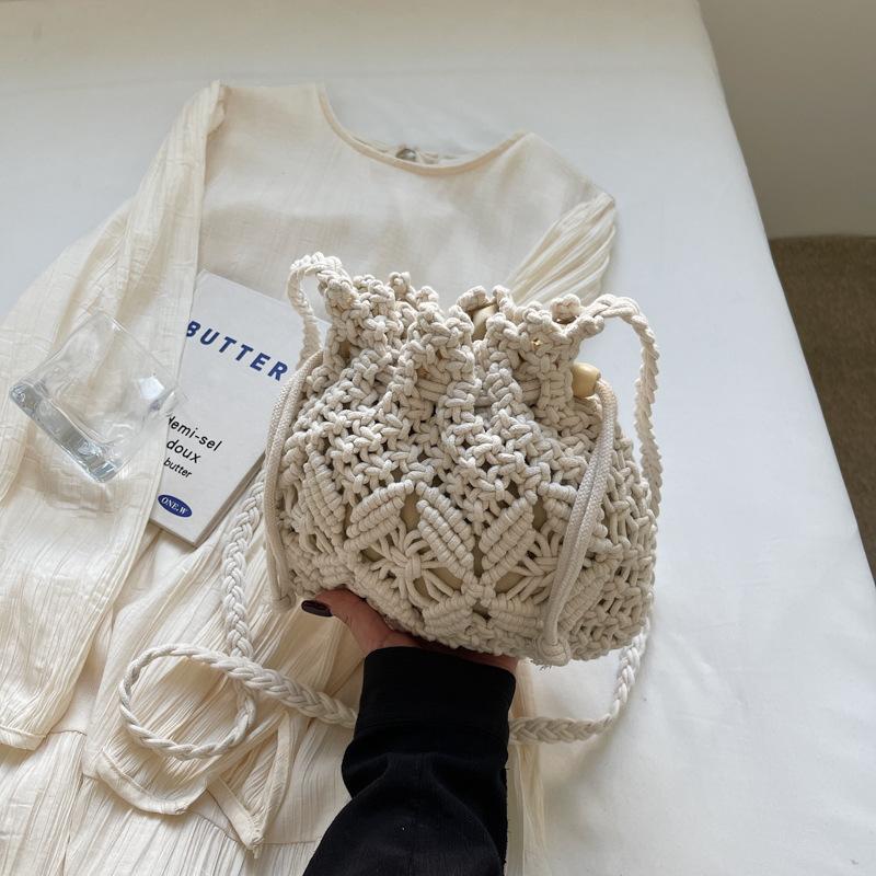 Woven straw bag women's summer versatile 2026 new fashion niche design crossbody bucket bag seaside beach bag
