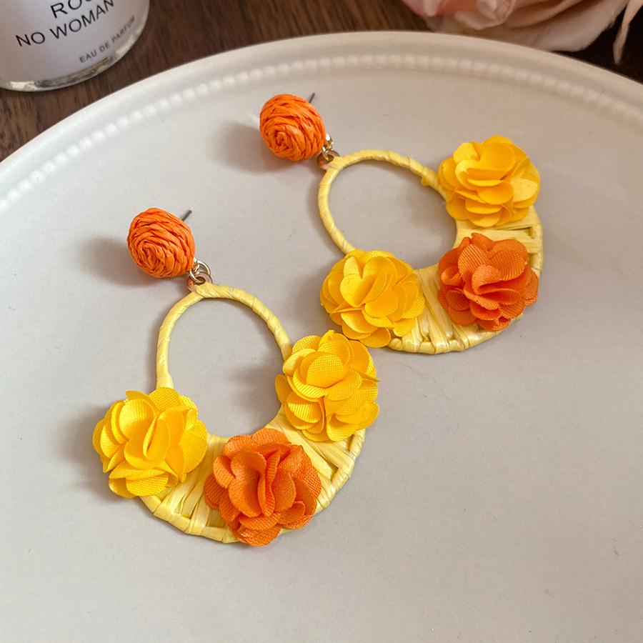 

Silver needle raffia fabric flower pendant earrings women s light luxury high sense exaggerated stud earrings holiday style versatile earrings