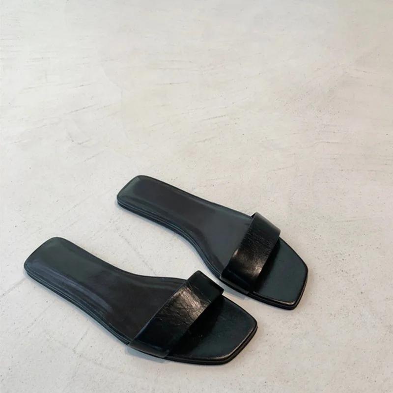

Модные женские новые черно-белые шлепанцы на плоской подошве, женские мюли из натуральной кожи с открытым носком на одном ремешке, женские летние шлепанцы, удобные сабо 35 чёрный