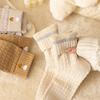 Chaussettes chaudes d'hiver pour femmes Broderie cœur d'amour coréen Chaussette mi-mollet Couleur unie Chaussettes éponge pour dames