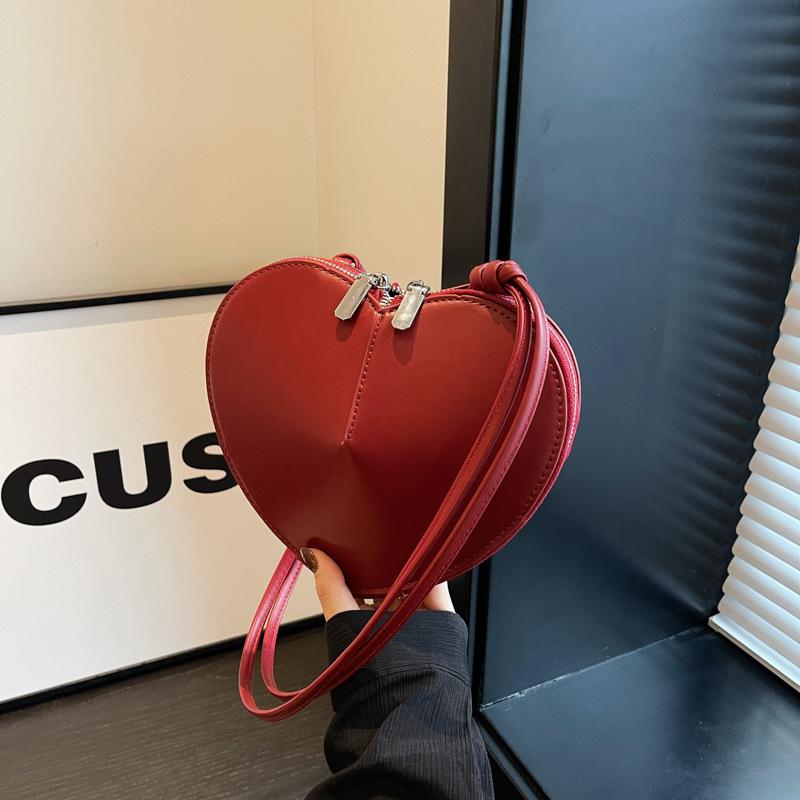 Niche design mini bag women's 2025 new fashion solid color love headphone bag crossbody change lipstick bag