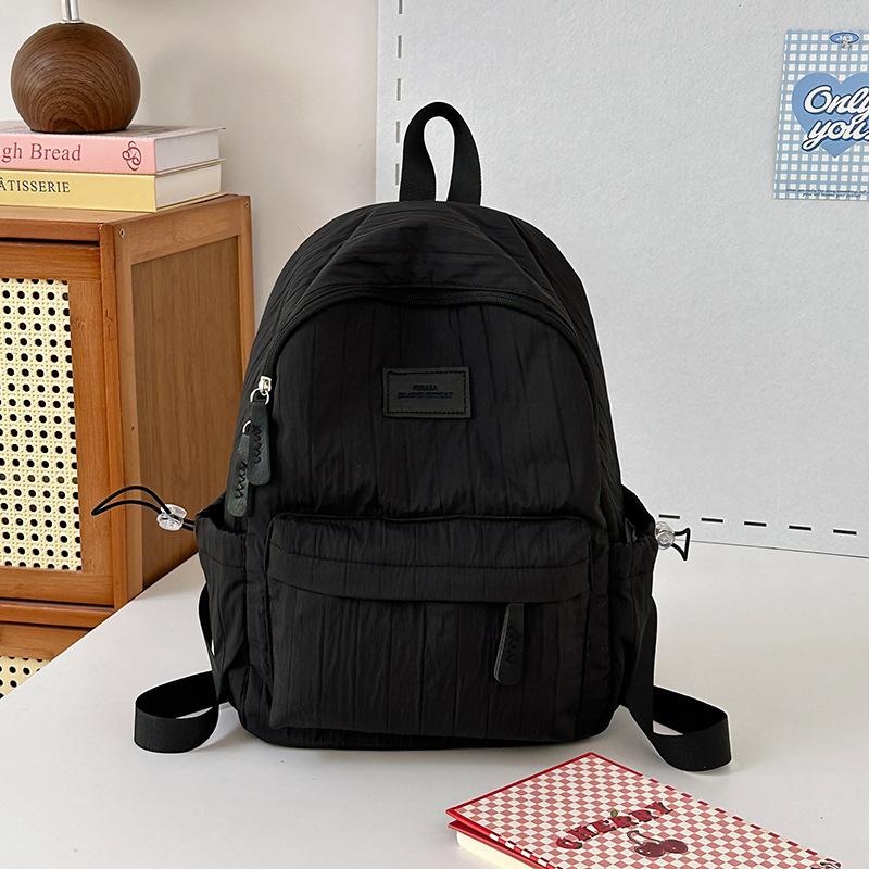 School bag junior high school girls large capacity solid color light primary school backpack high value girl versatile backpack