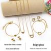 European Diamond-Accented Heart Jewelry Set: Necklace, Bracelet & Earrings in Titanium Steel for Women's Luxurious Style.