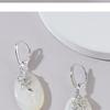 Exquisite Mother-of-Pearl Sterling Silver Luxury Earrings with Unique Face-Inspired Design