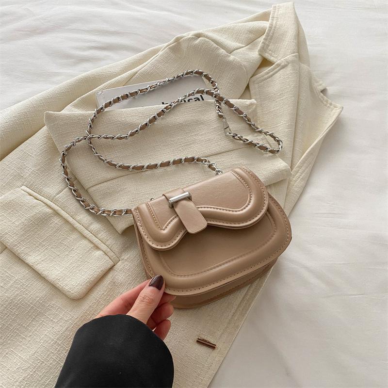 Textura de color sólido moda simple bolso pequeño bolso de cadena para mujer 2025 primavera nuevo versátil ins mensajero bolso de silla de montar
