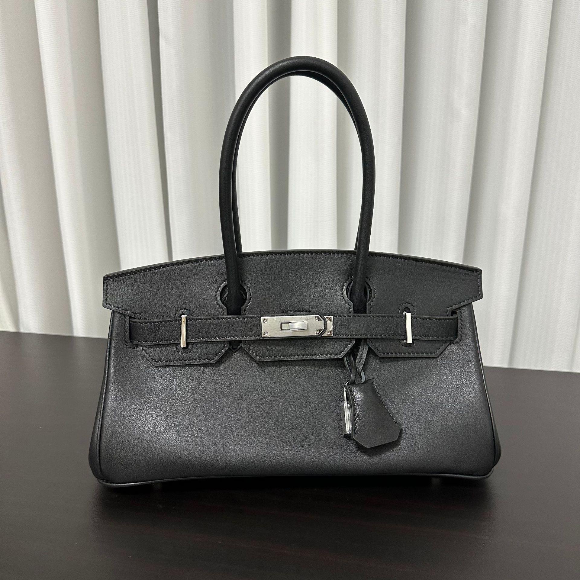 

Новая французская сумка-мешок Swift Leather 29 см с горизонтальным платиновым покрытием для носка из коровьей кожи, женская сумка из натуральной кожи 29x13.5x14.5cm чёрный