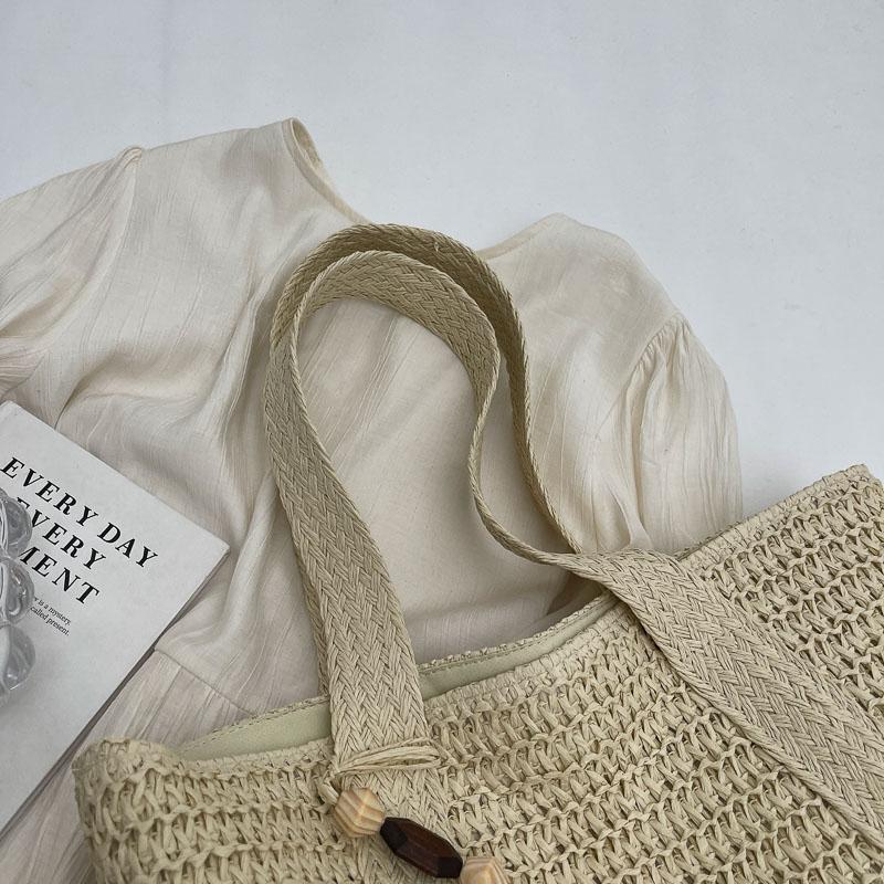 Handwoven Straw Tote Bag Women's Summer Beach Bag with Tassel Detail and Lightweight Design