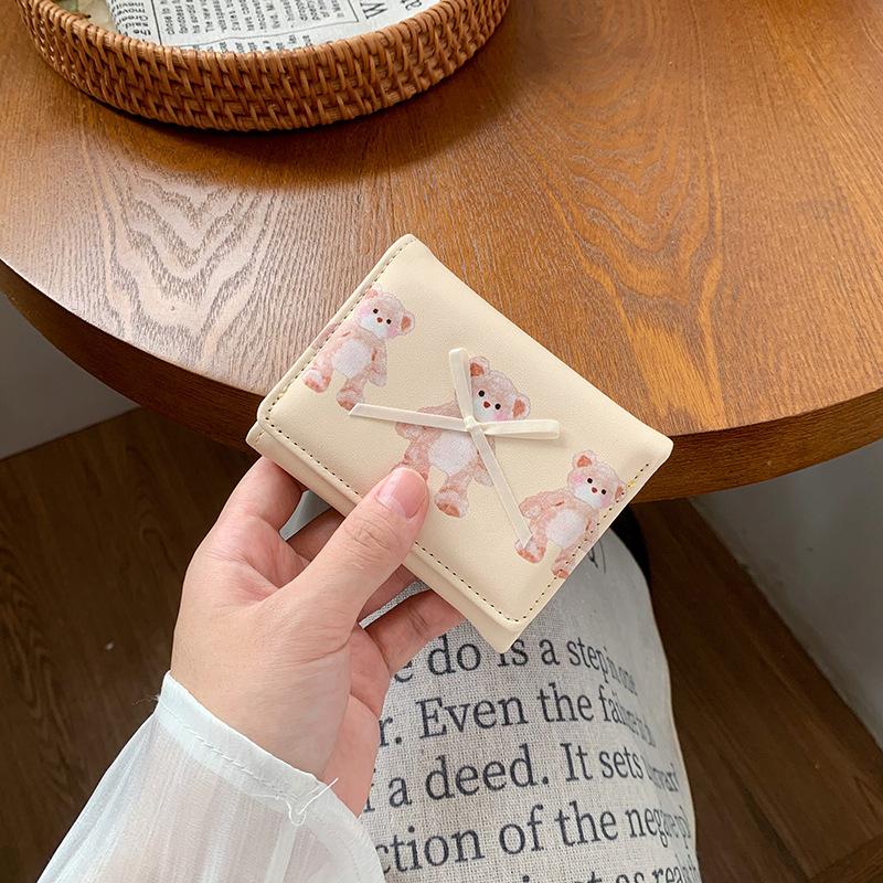 

Simple bow short women s wallet small fresh and cute three-fold plain student change clip card bag светло-желтого