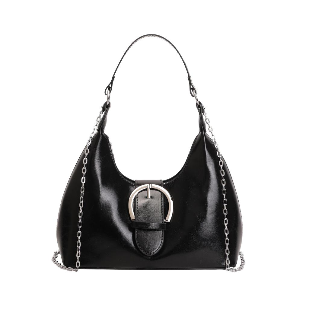 Solid color crescent-shaped hobo bag with metal D-ring embellishment, elegant underarm bag, versatile women's handbag for dates and everyday wear.