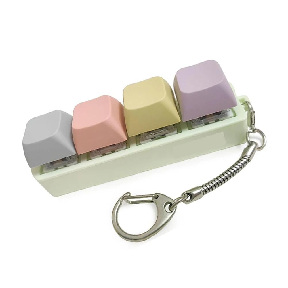 4-Tasten-Tastatur-Tasten-Spielzeug Party Stressabbau DIY Fidget-Tasten-Kappe Fidget-Schlüsselanhänger Tastatur-Schlüsselanhänger Spielzeug Finger-Tastatur