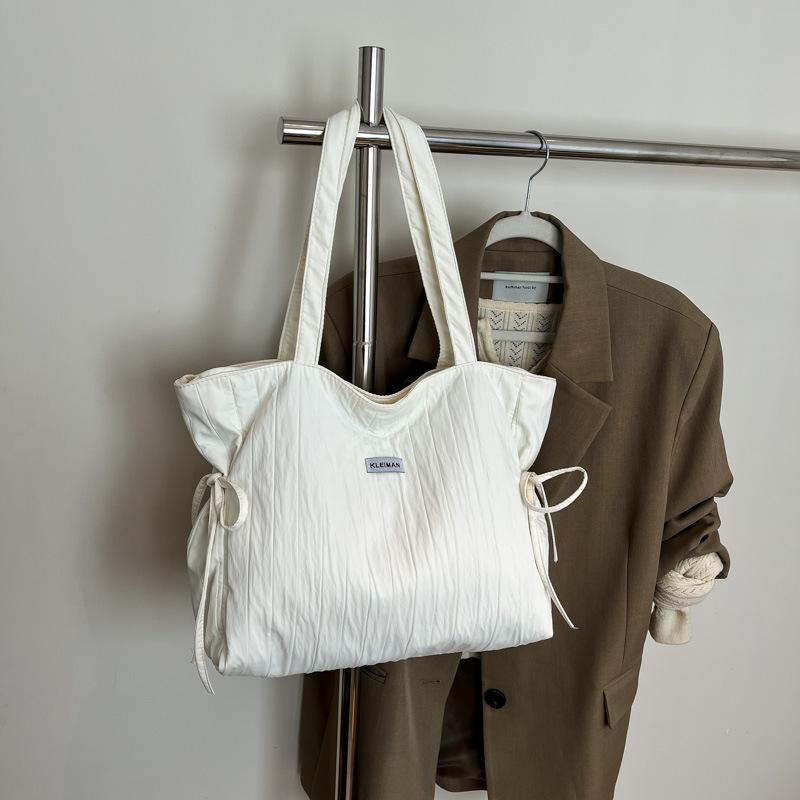 Casual tote bag, simple personality and large capacity fashion women 2025 spring commuting Korean lazy wind messenger bag women