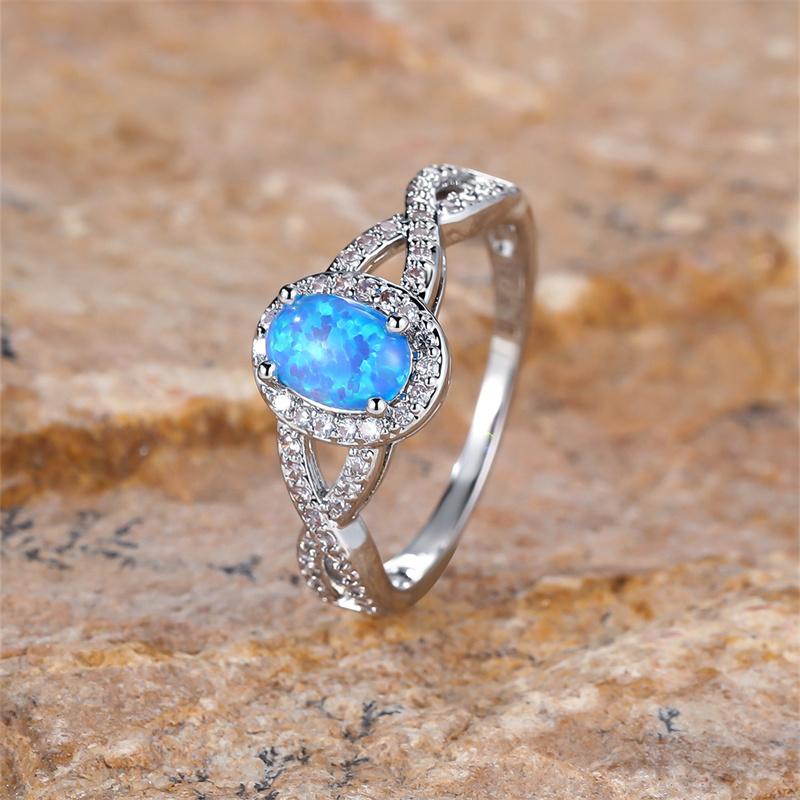 

Small Oval Stone Blue Opal Ring White Zircon Hollow Infinity Engagement Rings For Women Trendy Silver Color Wedding Band Jewelry 11