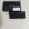 Used PRADA Bi-fold long wallet Black 1M1037 With guarantee card and box