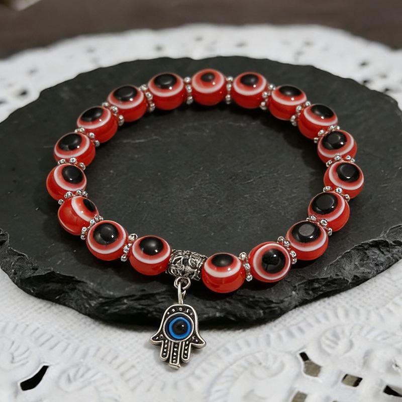 

Beaded Bracelet with Hamsa, Evil Eye, Butterfly, Turtle, and Elephant Charms
