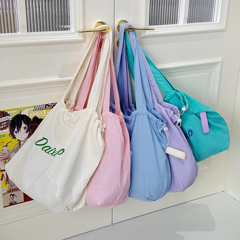 Korean New Drawstring Tote Bag Letter Printed Bag for Women Large Capacity Nylon Casual Versatile Portable Shoulder Bag