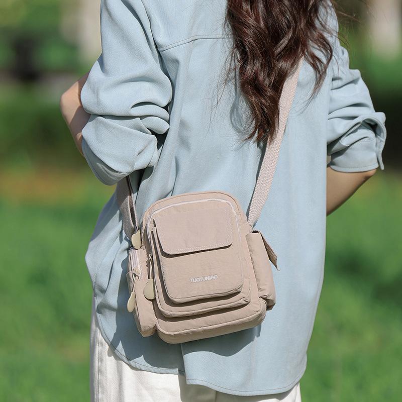 Casual waterproof multi-pocket commuter backpack 2025 summer new portable shoulder bag messenger bag