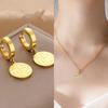 Gold Fu Character Stainless Steel Earring Pendant & Round Necklace Set for Women.