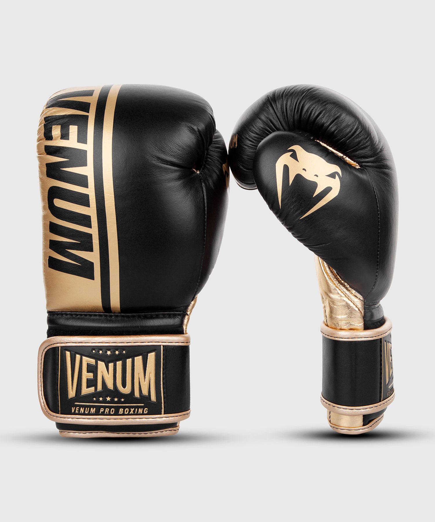 

Боксерские перчатки Venum Shield pro с липучкой - черный/золотой 10 Oz