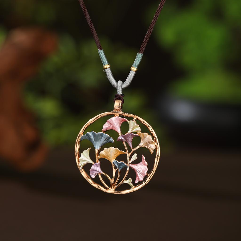 Pendentif long fleur géométrique creuse couleur émail, pendentif collier polyvalent en forme de cœur pour femme à sens élevé