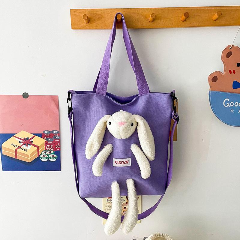 

Новая симпатичная сумка через плечо из холста с кроликом, вместительная студенческая сумка-мессенджер, сумка с мультяшной куклой для девочек фиолетовый