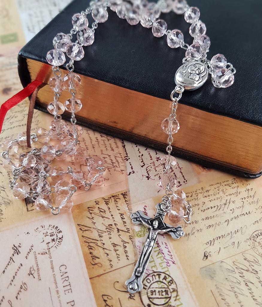 Light pink crystal bead rosary Catholic necklace with sacred earth medal and cross.