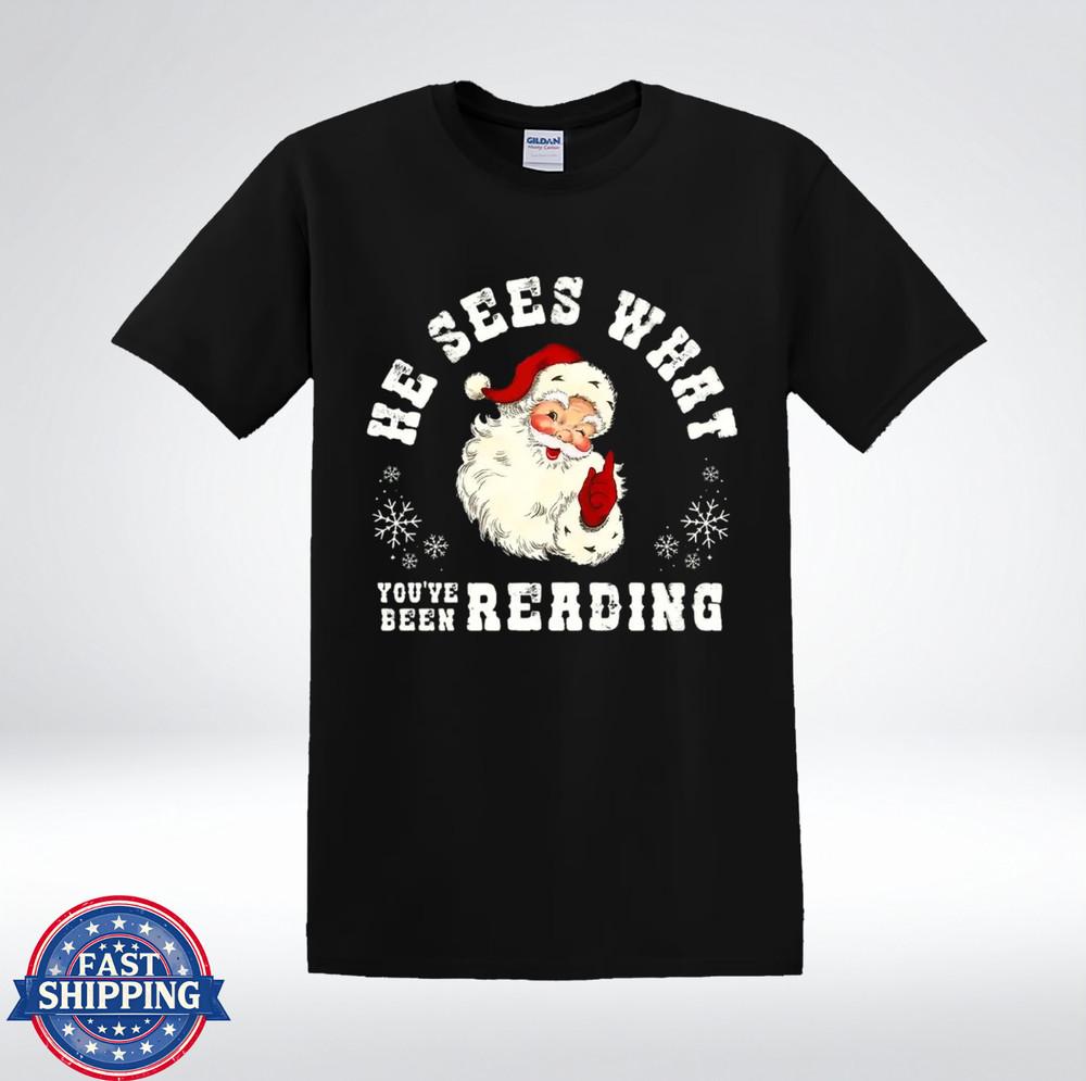 

Funny Santa He Sees What You’ve Been Reading Christmas Humor T-Shirt XL